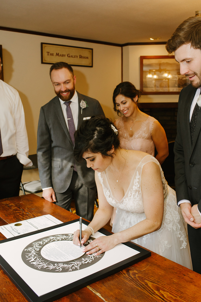 Friends and family celebrating the Ketubah renewal with the couple
